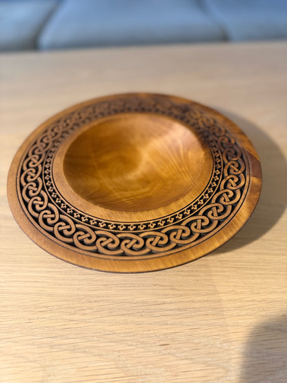 Turned teak-colored platter with Celtic border