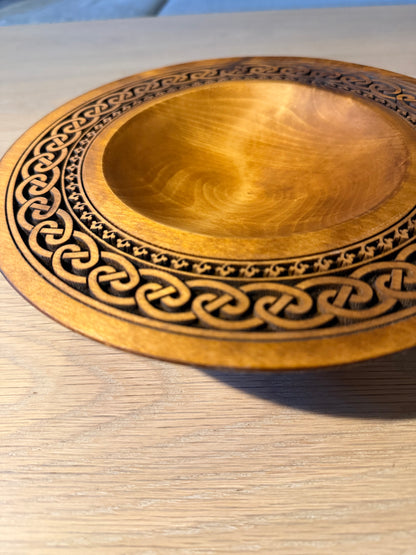 Turned teak-colored platter with Celtic border